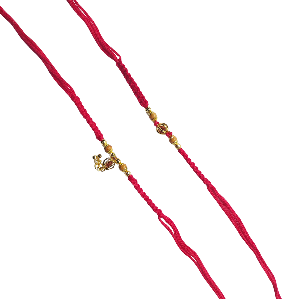 Elegant Gold Charm Bhai Bhabhi Rakhi Set