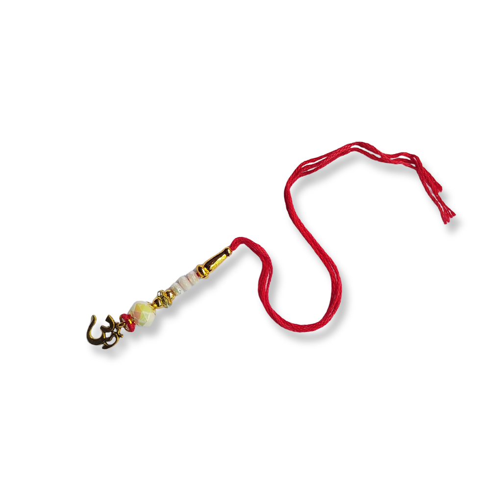 Elegant Pearl Lumba Rakhi with Golden Details